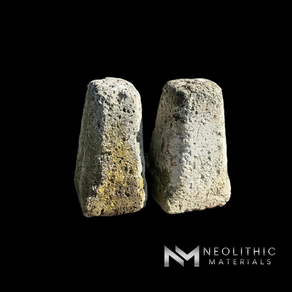 Miscellaneous FG105-12 to FG105-13 two weathered upright limestone pillars with rustic mossy surfaces standing on a wooden shipping pallet under bright outdoor sunlight.