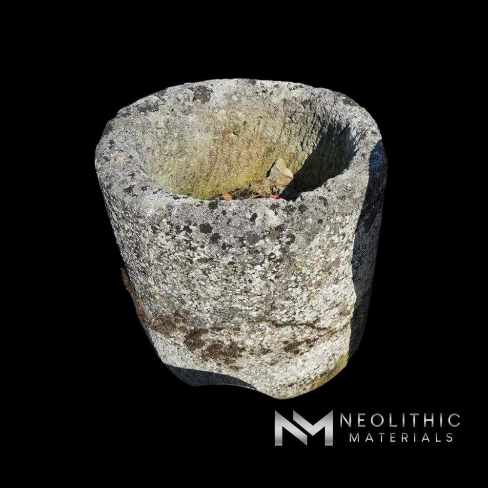 Trough FL101-05.MT ancient textured stone vessel with lichen growth photographed close-up from a high-angle perspective.