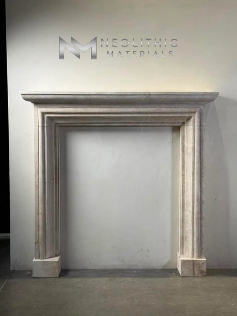 Fireplace LC101-05.68x9x65 straight-on eye-level showroom display of a classic stone mantel surround with elegant tiered molding details along the frame.