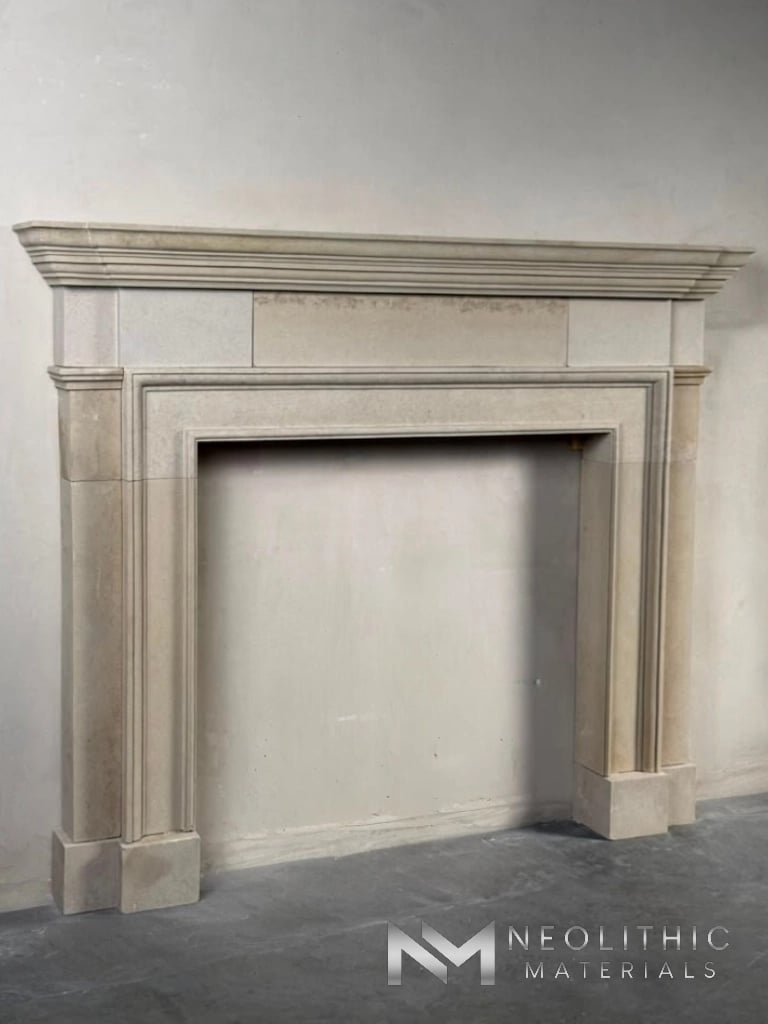 Fireplace LC101-12.69x9x57 eye-level studio installation view showcasing an elegant, classical-style stone fireplace mantel surround featuring clean geometric lines, a wide tiered top shelf crown, and a smooth off-white limestone texture.