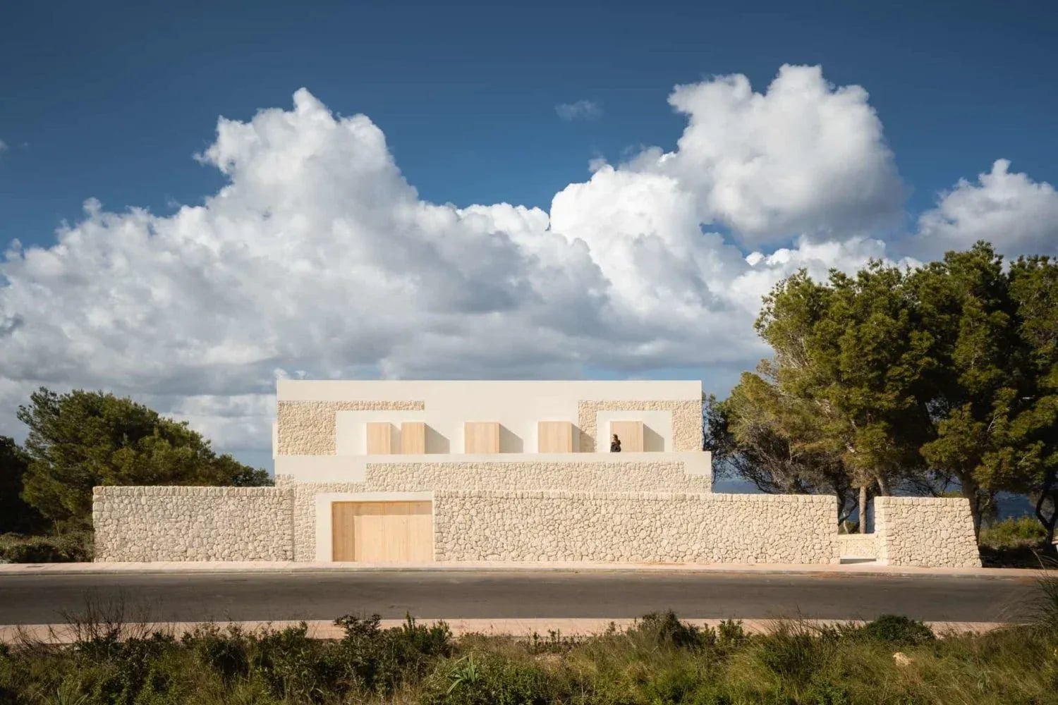 Aged and Weathered Stone, Modern minimalist house with a light-colored local stone facade and perimeter wall